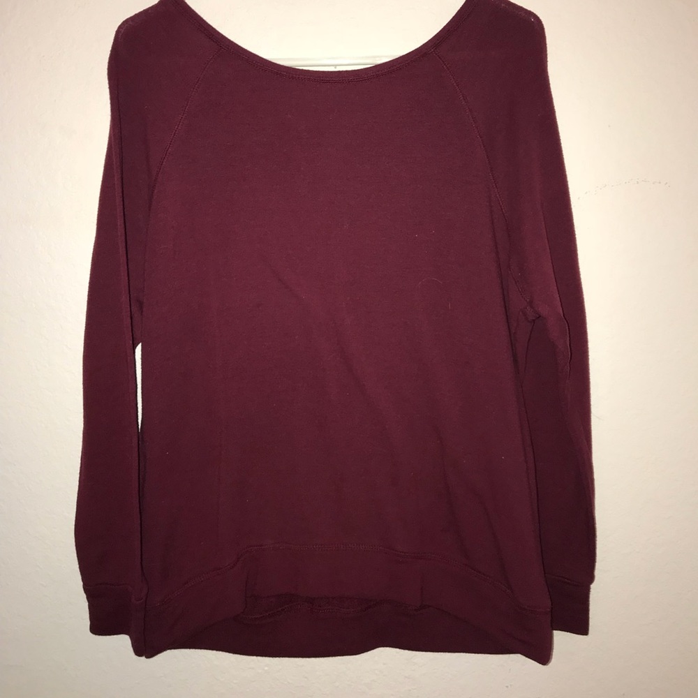 A maroon sweater